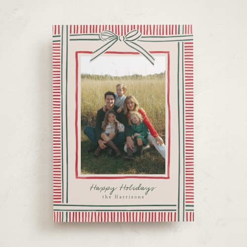 This is a ruby holiday photo cards with standard by Chris Griffith called holiday wrap printing on recycled smooth signature in standard