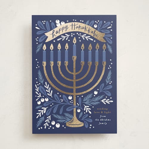 This is a navy hanukkah cards with foil pressed by Alethea and Ruth called hanukkah greenery printing on signature in standard