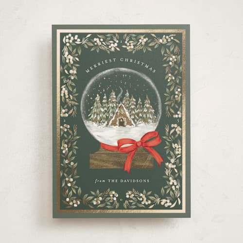 This is a forest foil pressed holiday cards with foil pressed by Jackie Crawford called cabin snow globe printing on signature in standard
