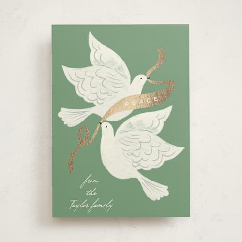This is a sage foil pressed holiday cards with foil pressed by Alethea and Ruth called peace birds printing on signature in standard