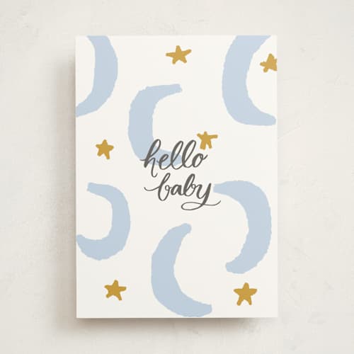 This is a baby blue new baby greeting cards with standard by Lea Velasquez called moon and stars printing on signature in greeting cards
