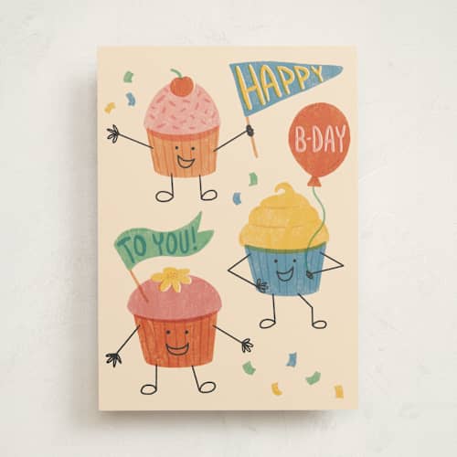 This is a cream birthday cards with standard by Rebekah Canavan called cupcake cheer printing on signature in greeting cards