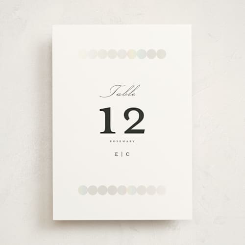 This is a silk table numbers with foil pressed by mo kelley called pearls printing on doublethick in standard