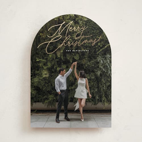 This is a snowfall foil pressed holiday cards with foil pressed by Melanie Kosuge called merry monoline printing on recycled smooth signature in standard