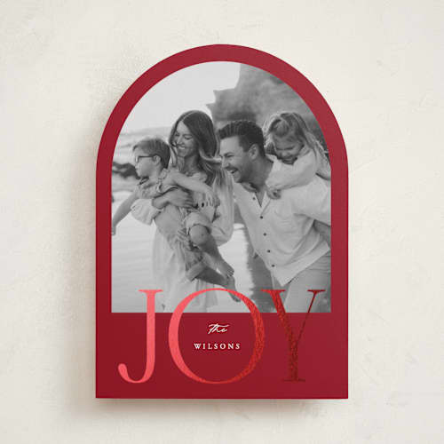 This is a cranberry foil pressed holiday cards with foil pressed by Brianne Larsen called joy arch printing on recycled smooth signature in standard