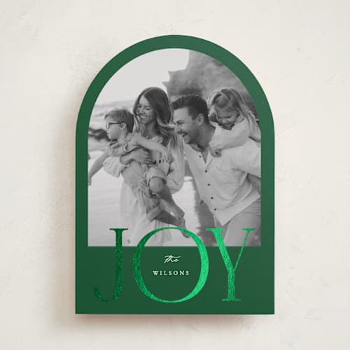 This is a pine foil pressed holiday cards with foil pressed by Brianne Larsen called joy arch printing on recycled smooth signature in standard