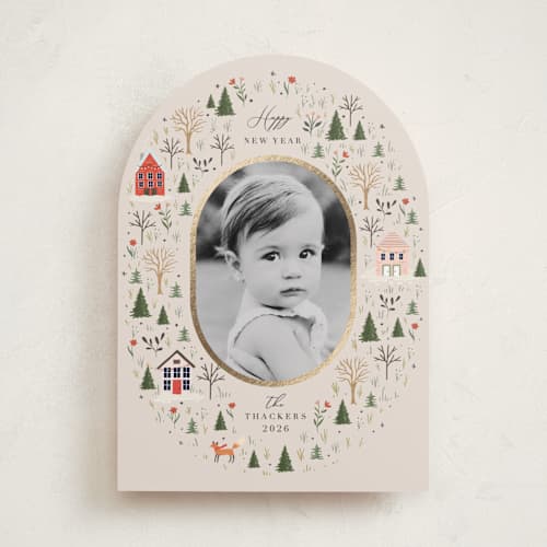 This is a taffy foil pressed holiday cards with foil pressed by Hannah Williams called winter village oval printing on recycled smooth signature in standard