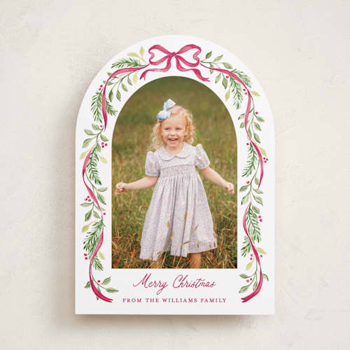 This is a berry holiday photo cards with standard by Sarah Knight called ribbon arch printing on recycled smooth signature in standard