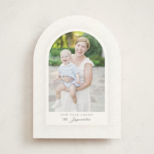 This is a snow gloss press holiday cards with gloss press by Kamala Nahas called frosted arch printing on signature in standard