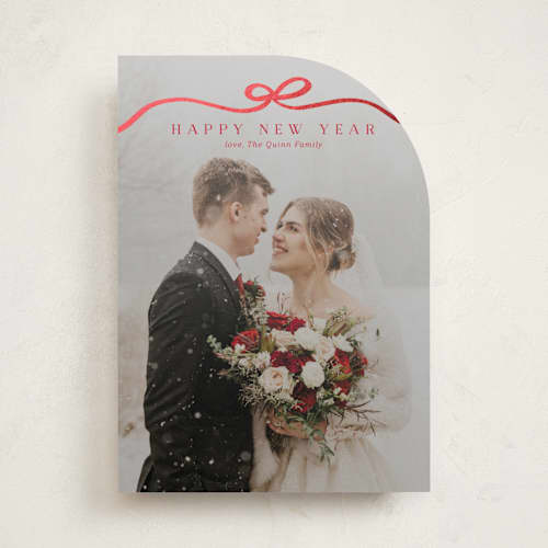 This is a cardinal foil pressed holiday cards with foil pressed by Kaydi Bishop called bow tied printing on recycled smooth signature in standard