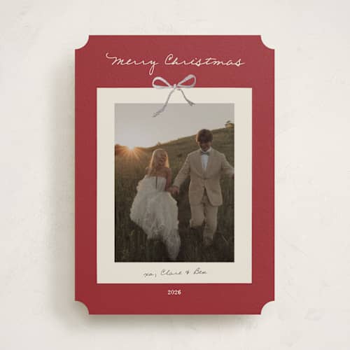 This is a crimson foil pressed holiday cards with foil pressed by Ani Somi called bow on it printing on recycled smooth signature in standard