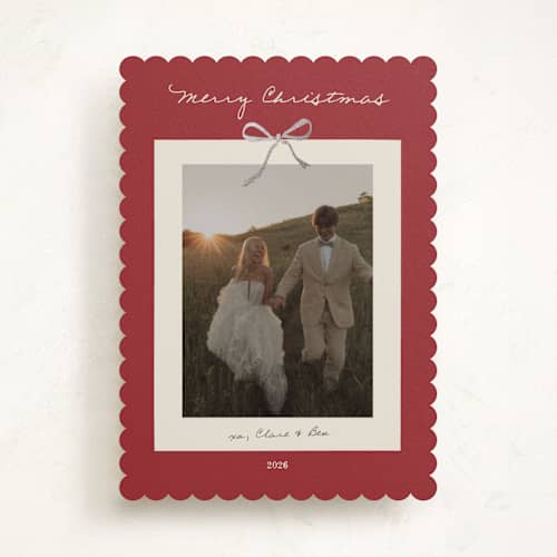 This is a crimson foil pressed holiday cards with foil pressed by Ani Somi called bow on it printing on recycled smooth signature in standard