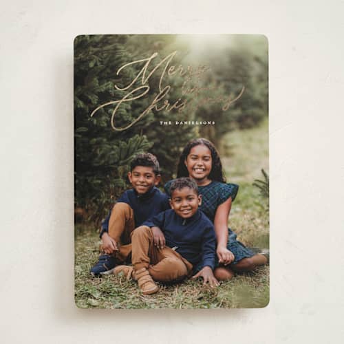 This is a snowfall foil pressed holiday cards with foil pressed by Melanie Kosuge called merry monoline printing on recycled smooth signature in standard