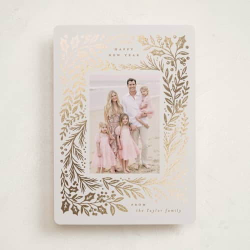This is a buttercream foil pressed holiday cards with foil pressed by Alethea and Ruth called gilded forest printing on recycled smooth signature in standard
