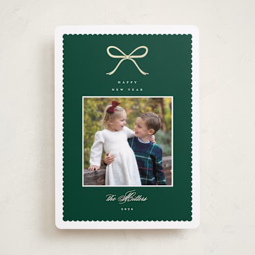 This is a pine foil pressed holiday cards with foil pressed by Emily Betts called scallop bow printing on recycled smooth signature in standard
