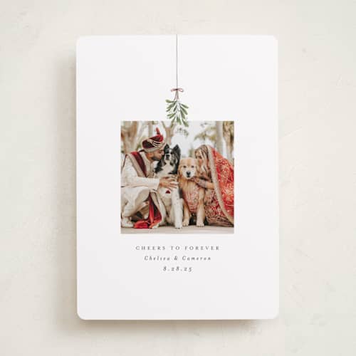 This is a winter holiday photo cards with standard by Randi Cirelli called married and merry printing on recycled smooth signature in standard