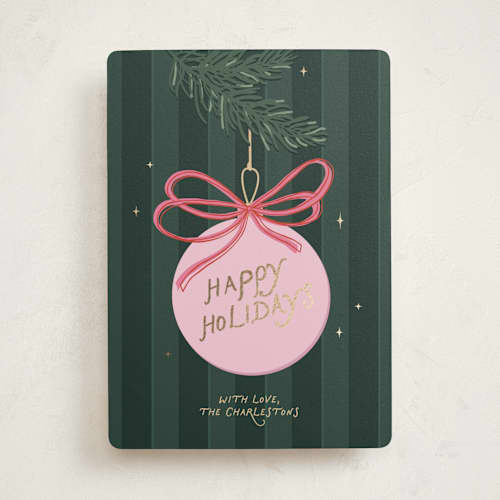 This is a pine needle foil pressed holiday cards with foil pressed by Roseberry called merry bow printing on signature in standard