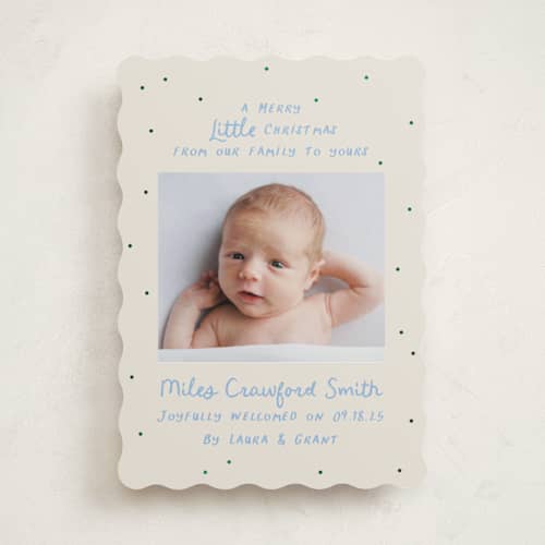 This is a powder babys first christmas with foil pressed by Megan Davis called little merry printing on recycled smooth signature in standard