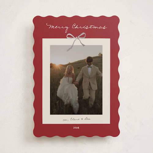 This is a crimson foil pressed holiday cards with foil pressed by Ani Somi called bow on it printing on recycled smooth signature in standard