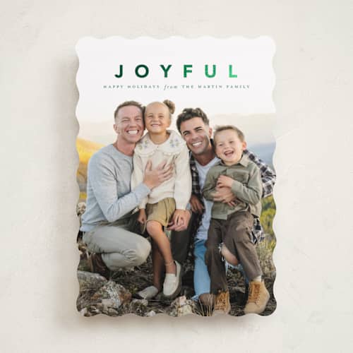 This is a wreath foil pressed holiday cards with foil pressed by Laura Hamm called a joyful family printing on recycled smooth signature in standard