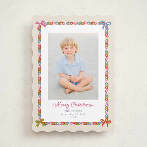 This is a buttercream holiday photo cards with standard by Erika Firm called paperchain border printing on recycled smooth signature in standard