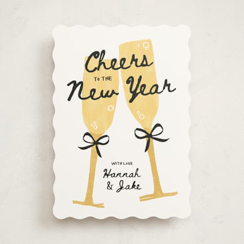 This is a champagne non photo holiday cards with standard by Kamala Nahas called cheers printing on signature in standard