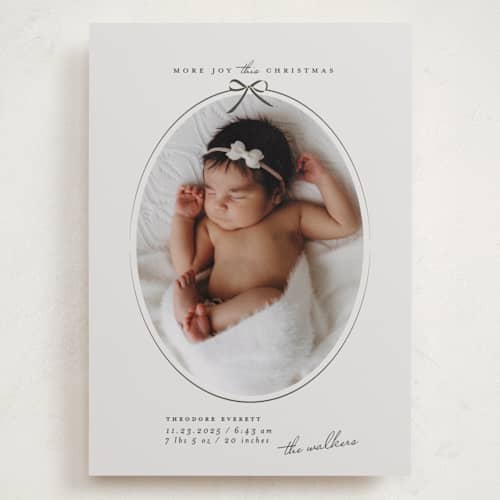 This is a pine babys first christmas with standard by Maja Cunningham called more joy printing on recycled smooth signature in grand