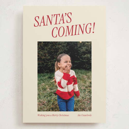 This is a candy cane holiday photo cards with standard by Angela Garrick called santa's coming printing on signature in grand