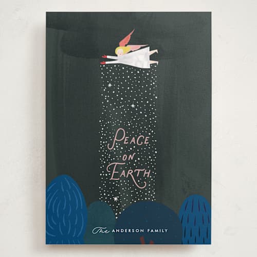 This is a forest holiday photo cards with standard by Eve Schultz called snow angel printing on signature in grand