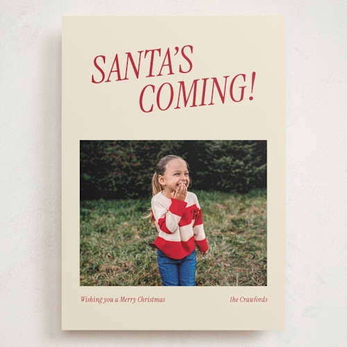 This is a candy cane holiday photo cards with standard by Angela Garrick called santa's coming printing on signature in grand