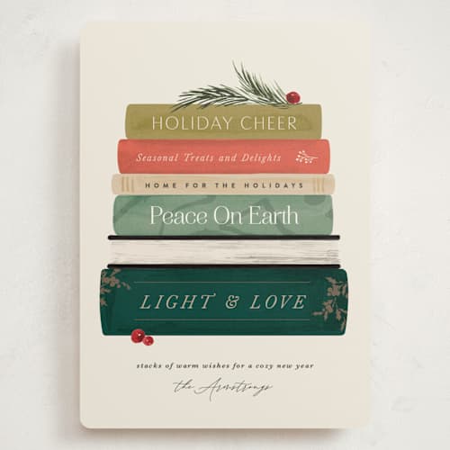 This is a holly jolly holiday photo cards with standard by Kate Ahn called book stack printing on signature in grand
