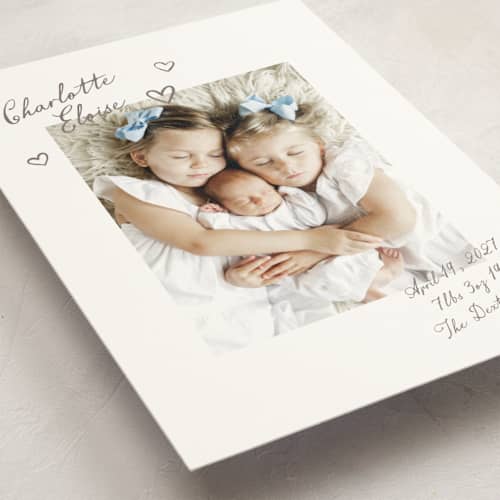 This is a sand birth announcement postcards with standard by Pixel and Hank called written printing on signature in postcard