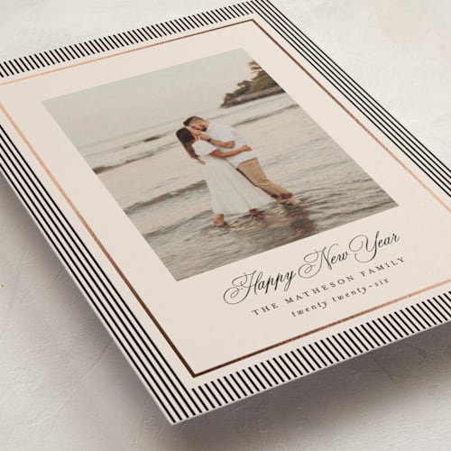 This is a linen petite holiday cards with foil pressed by Kelly Schmidt called striped elegance printing on signature in petite