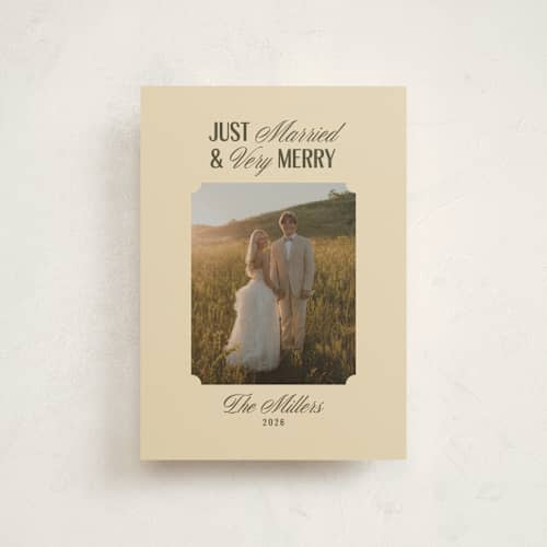 This is a ivory petite holiday cards with standard by Ana de Sousa called just married & merry printing on signature in petite
