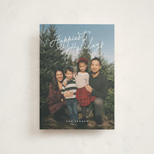 This is a snow christmas postcards with standard by Angela Garrick called happy curly script printing on signature in postcard