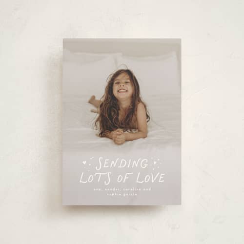 This is a cloud valentine postcards with standard by Lea Delaveris called sending lots of love printing on signature in postcard
