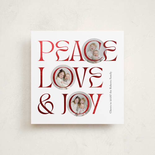 This is a snow foil pressed holiday cards with foil pressed by Carolyn Kach called peace love & joy printing on recycled smooth signature in square