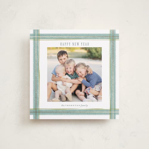 This is a wintermint foil pressed holiday cards with foil pressed by Paula Pecevich called brushed plaid printing on recycled smooth signature in square