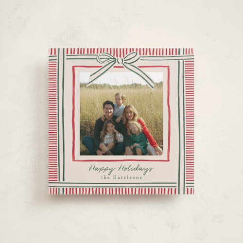 This is a ruby holiday photo cards with standard by Chris Griffith called holiday wrap printing on recycled smooth signature in square