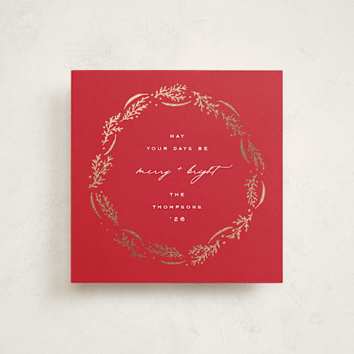 This is a poinsettia foil pressed holiday cards with foil pressed by Amy Kross called wrapped wreath printing on signature in square