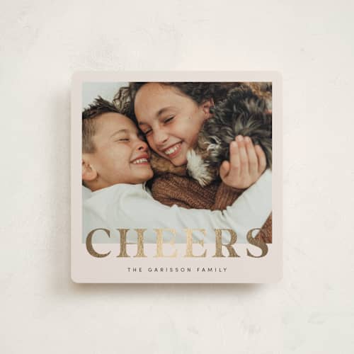 This is a champagne foil pressed holiday cards with foil pressed by Ilene Guy called ny cheers printing on recycled smooth signature in square