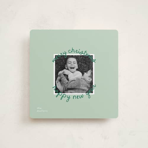 This is a mistletoe holiday photo cards with standard by Christie Garcia called circale printing on recycled smooth signature in square