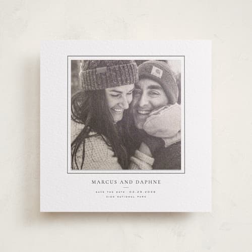 This is a soft black save the date with letterpress by Wildfield Paper Co called daisies printing on luxe white cotton in photo_mount