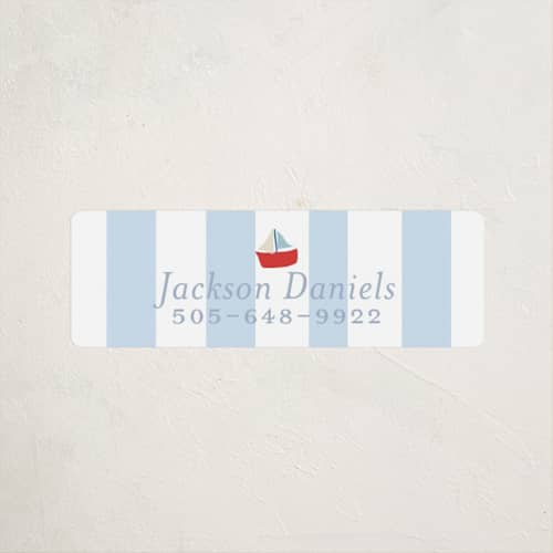 This is a periwinkle name labels with standard by Angela Thompson called sail boats baby printing on waterproof sticker paper in sticker