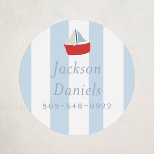 This is a periwinkle name labels with standard by Angela Thompson called sail boats baby printing on waterproof sticker paper in sticker