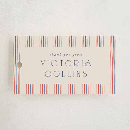 This is a navy graduation tags with standard by Claudia Orengo called past and future printing on signature in tag