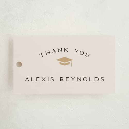 This is a ecru graduation tags with standard by Hooray Creative called official party printing on signature in tag