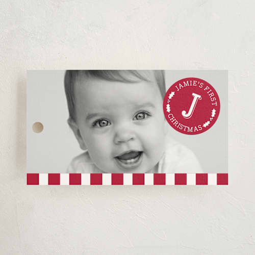 This is a holly berry gift tags with standard by Susan Asbill called first christmas printing on signature in tag