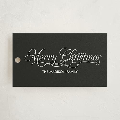 This is a black gift tags with standard by Nam Bourassa called modern elegance printing on signature in tag
