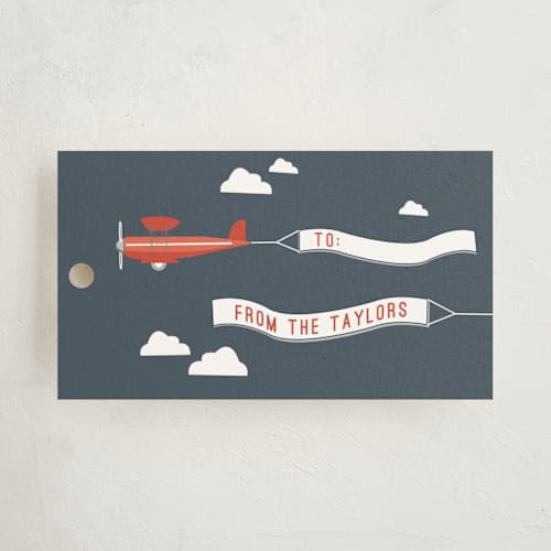 This is a navy gift tags with standard by R studio called in flight printing on signature in tag